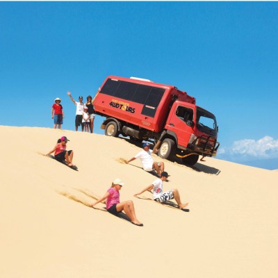 a person riding skis down a snow covered slope